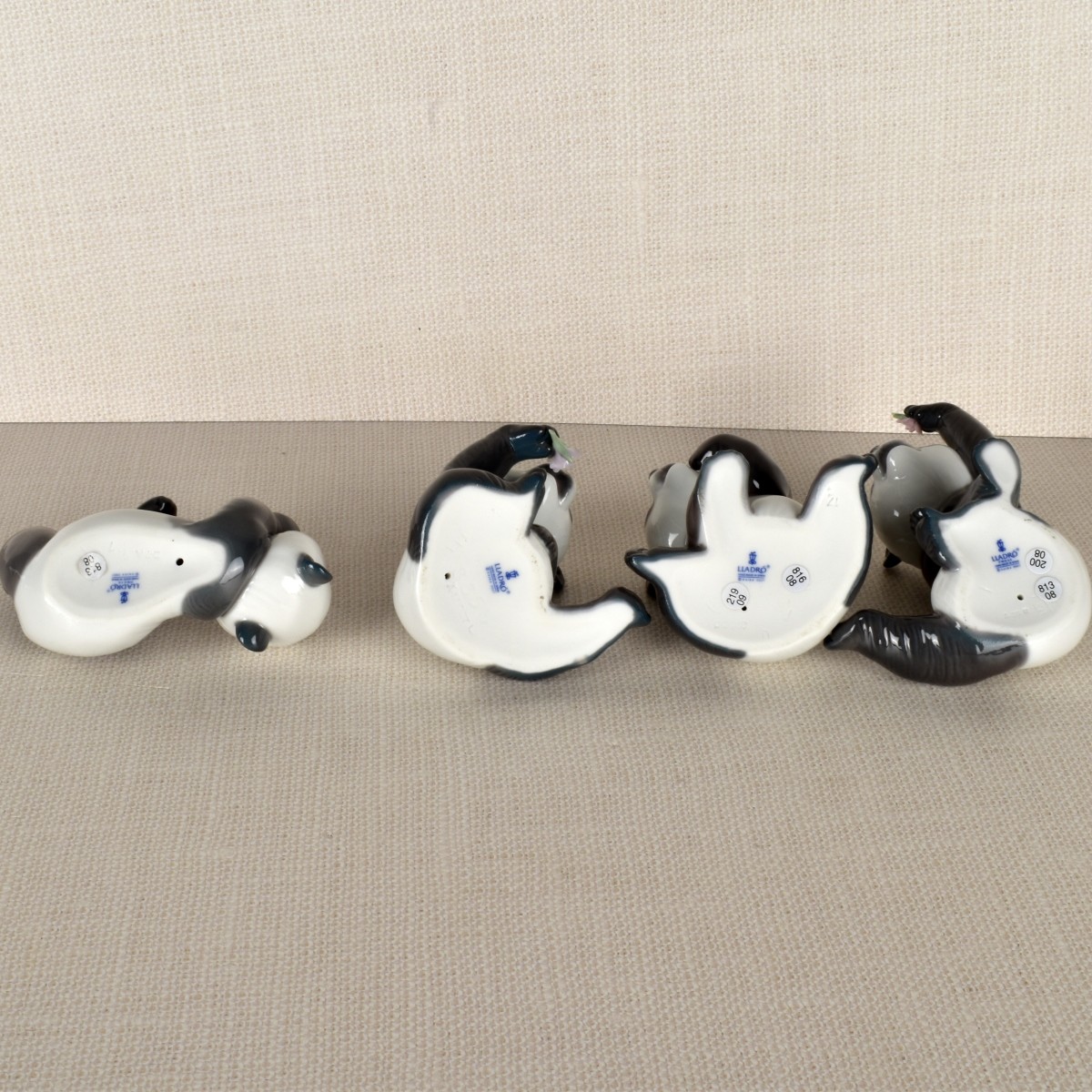Four Lladro Porcelain Panda Figurines