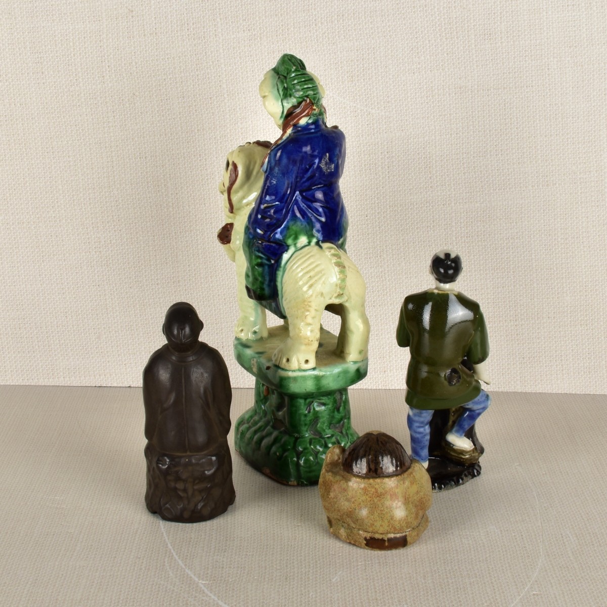 Four (4) Asian Porcelain Figures