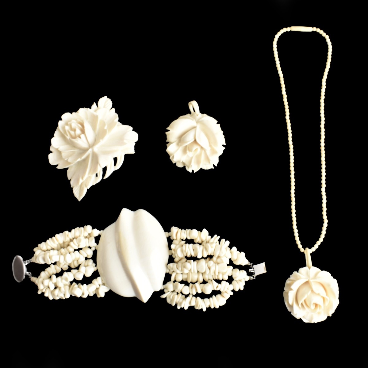Four Carved Jewelry Items