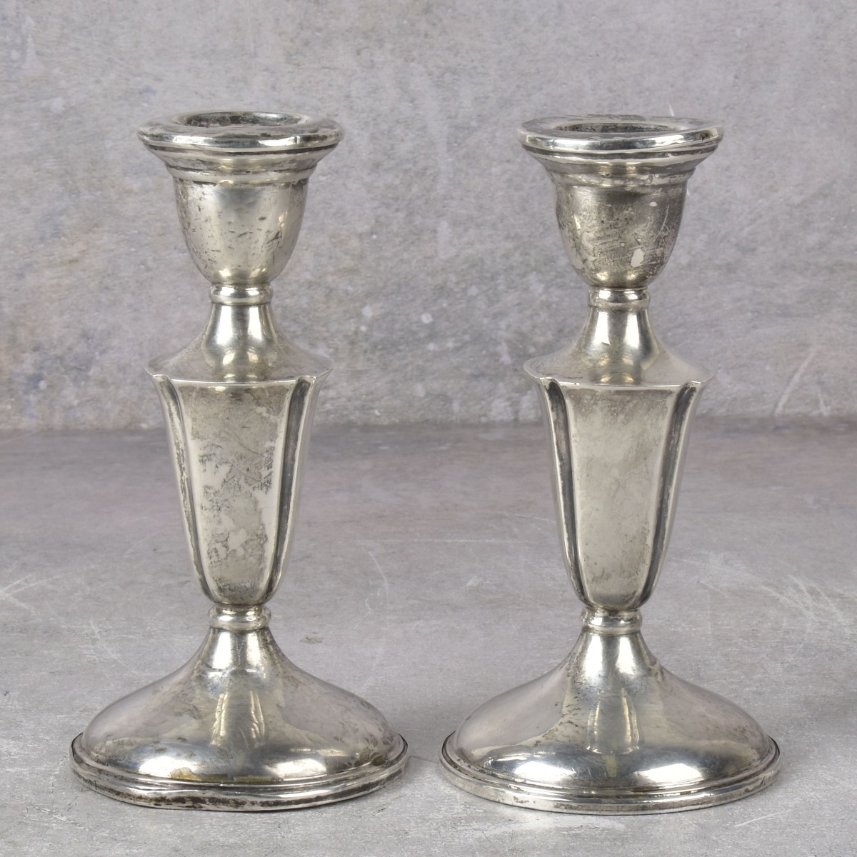 Pair of Weight Sterling Silver Candlesticks