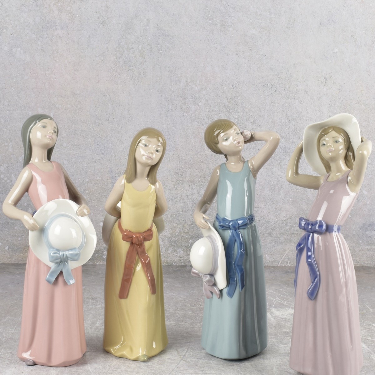 Lladro "Girl with Hat" Sculptures