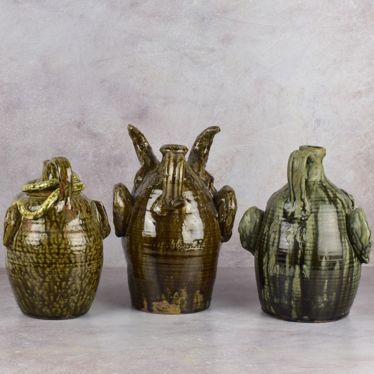 W.A. Flowers Folk Art Pottery Jugs