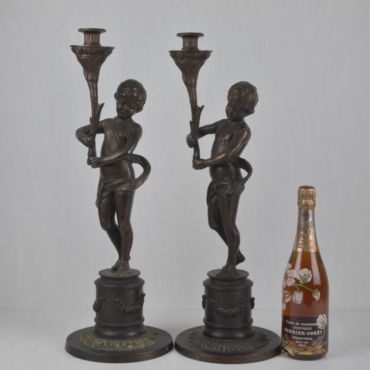 Pair of Bronze Figural Candlesticks