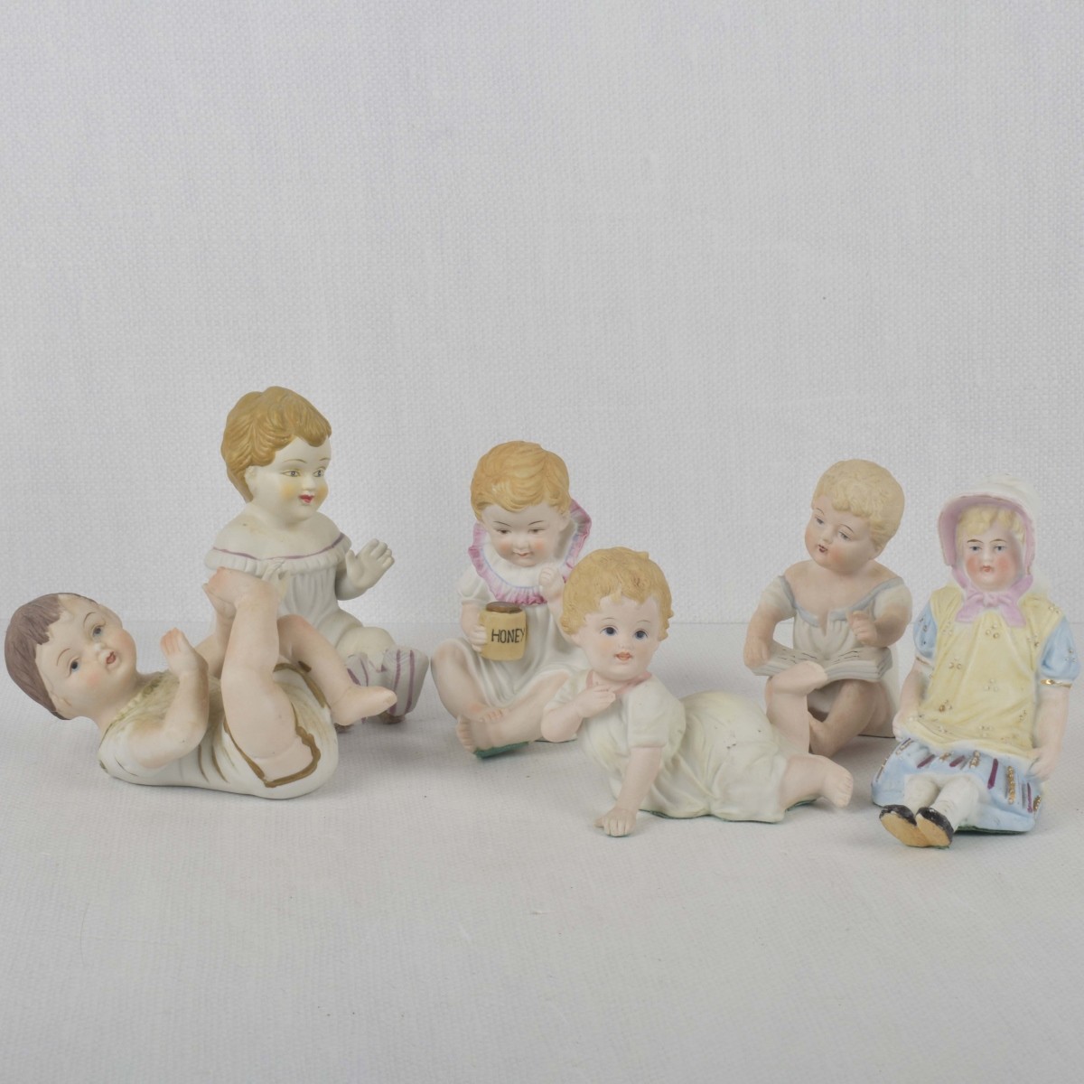 Porcelain Bisque Piano Babies