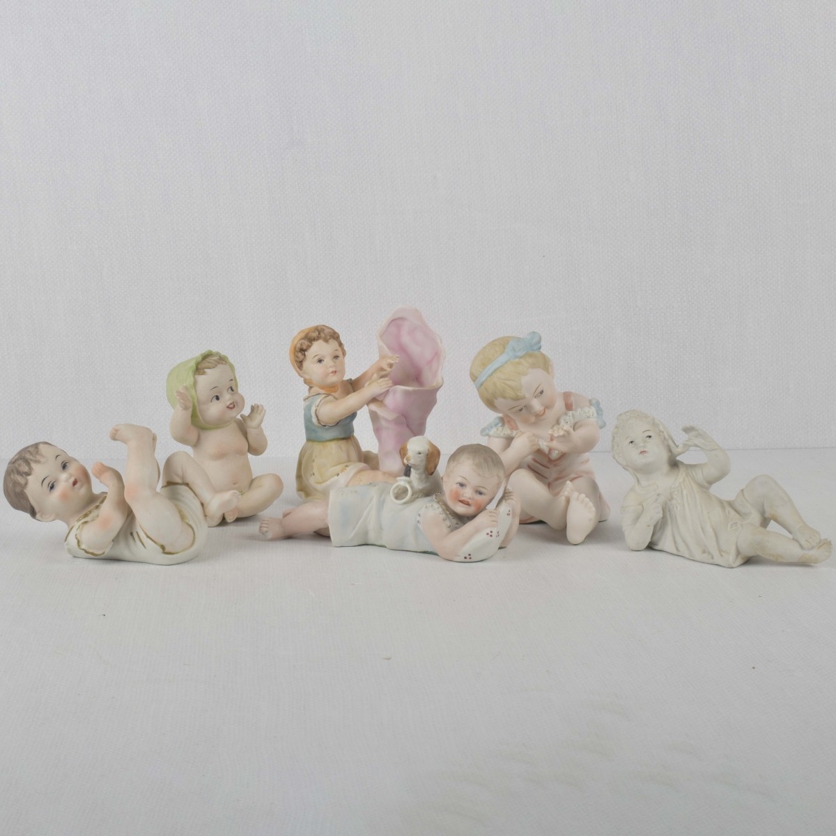 Porcelain Bisque Piano Babies