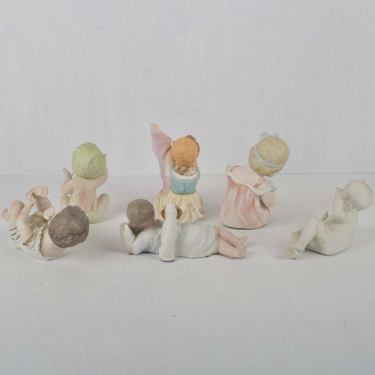 Porcelain Bisque Piano Babies