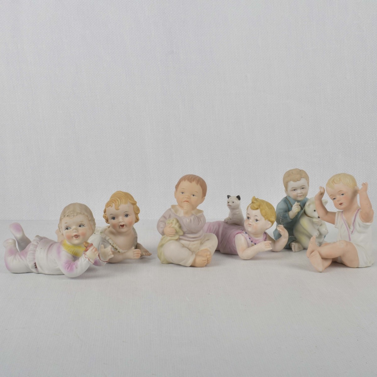 Porcelain Bisque Piano Babies