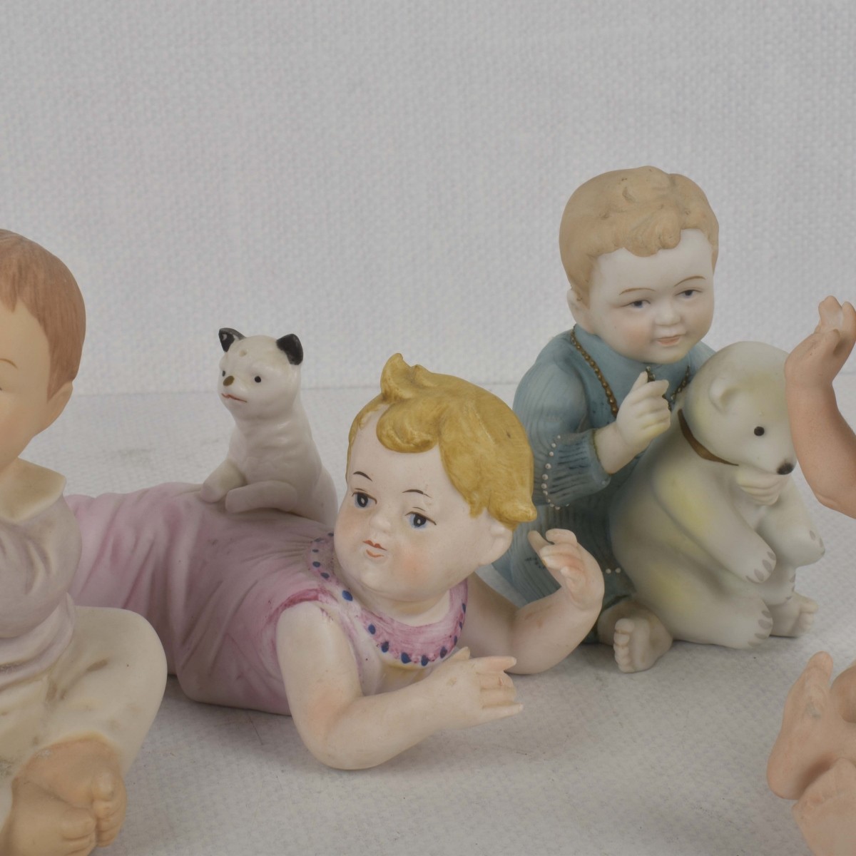 Porcelain Bisque Piano Babies