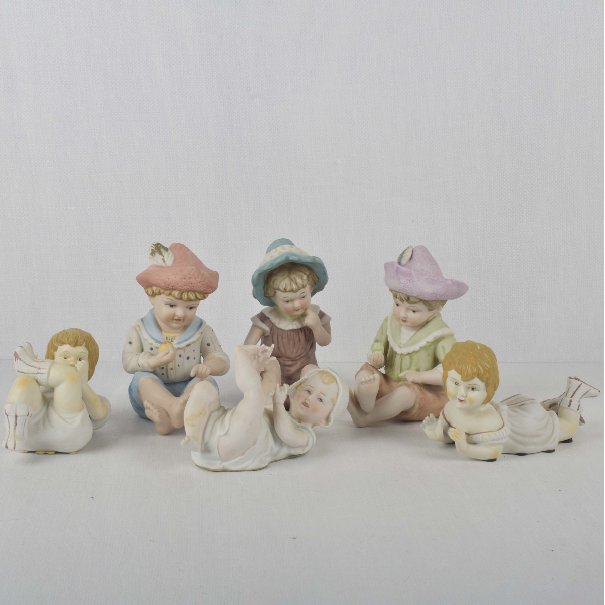 Porcelain Bisque Piano Babies