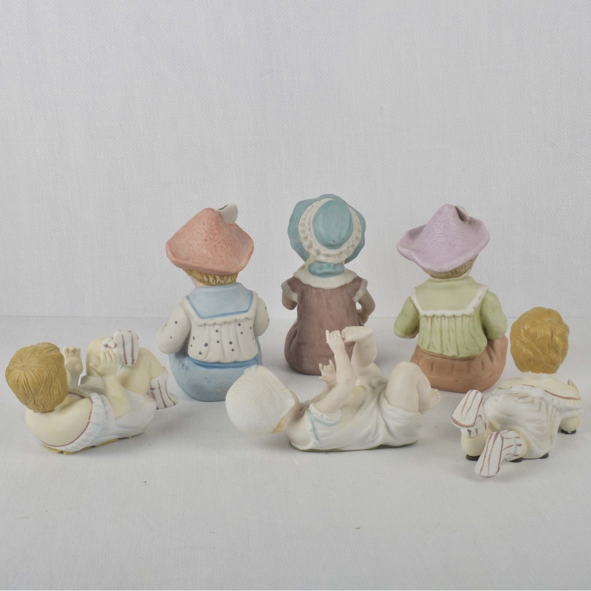 Porcelain Bisque Piano Babies