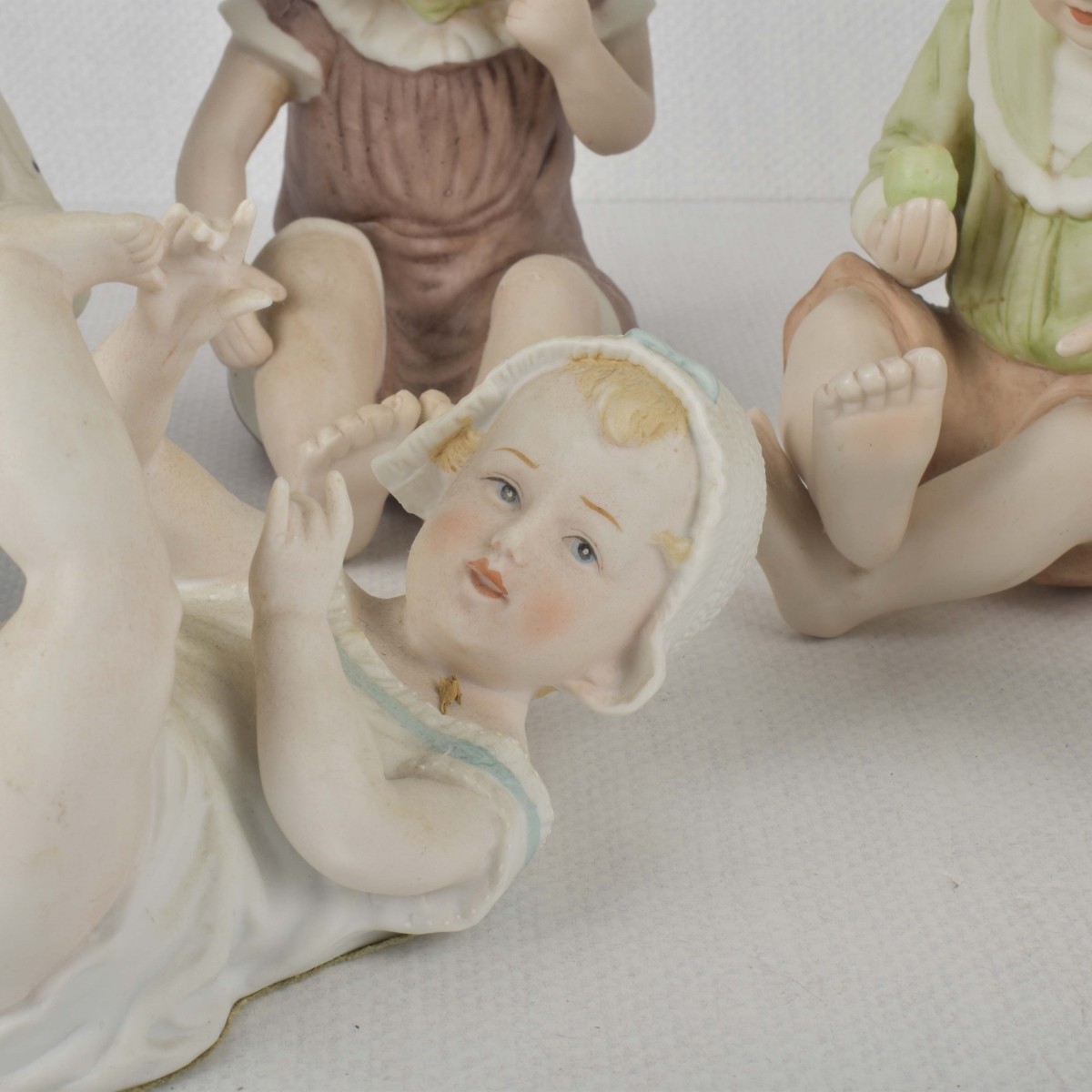 Porcelain Bisque Piano Babies